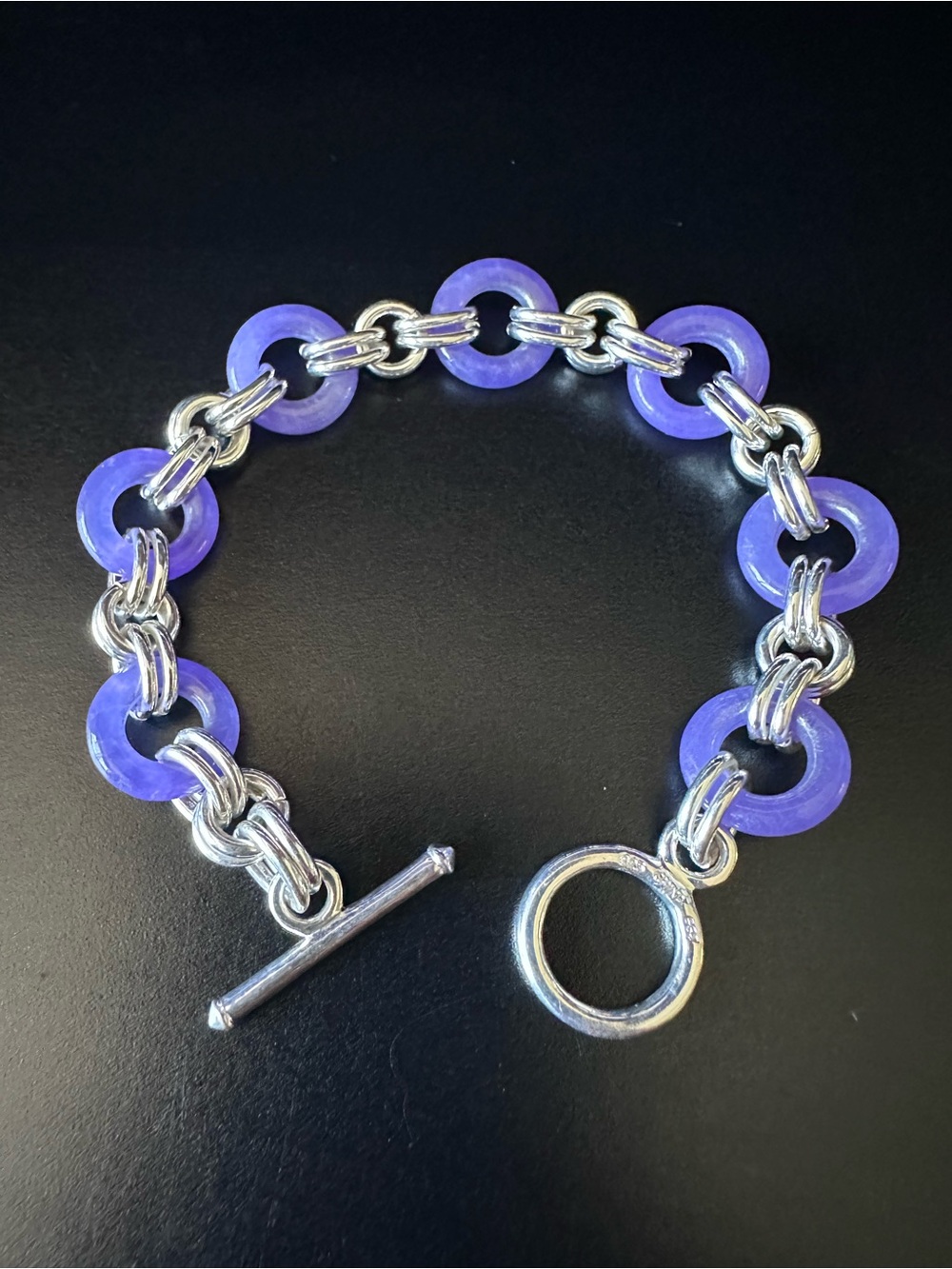 Rare Art Deco bracelet with lavender jadeite rings and sterling silver.